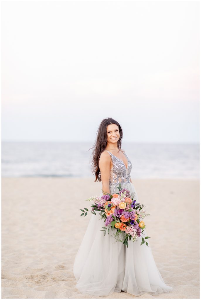 Bride walks along the beach during New Jersey Beach Elopement Session photographed by Diana and Korey Photo and Film.