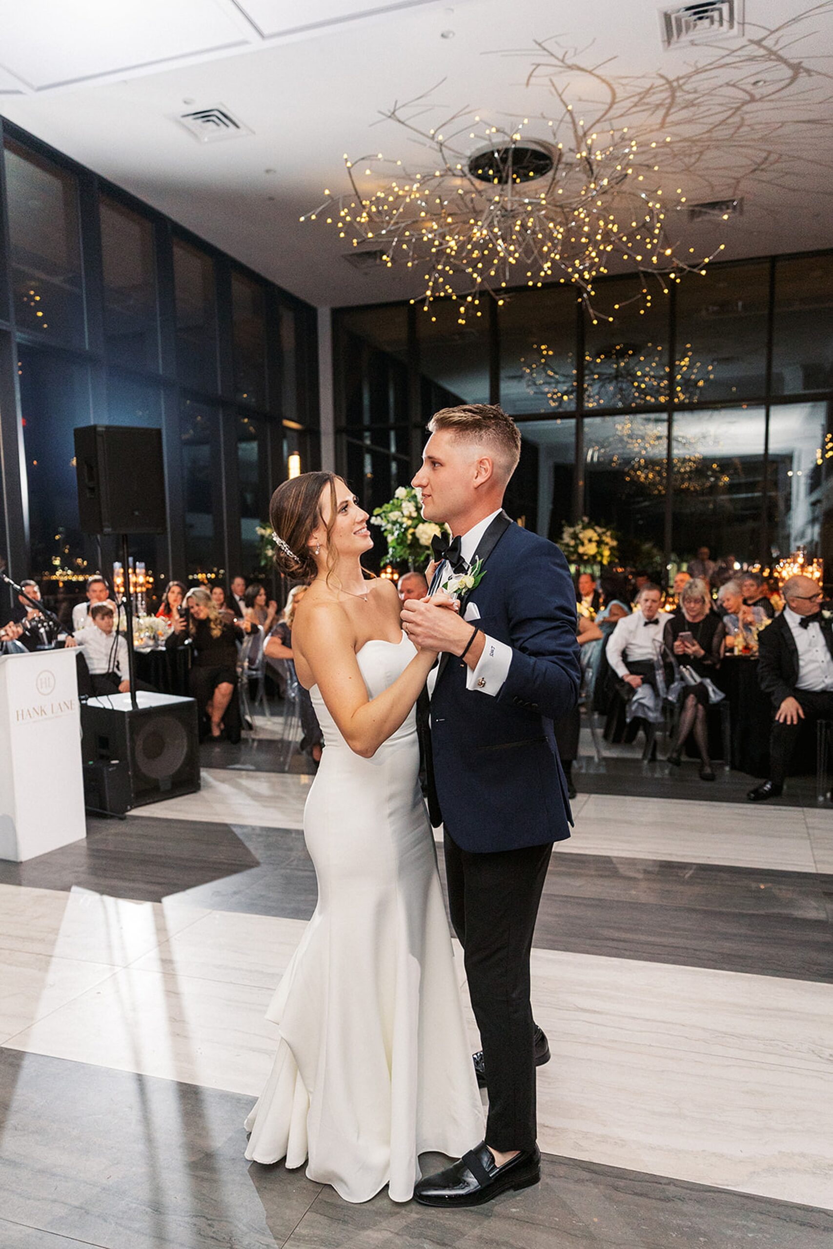 Newlyweds dance together for the first time surrounded by their guests at a Hudson House wedding