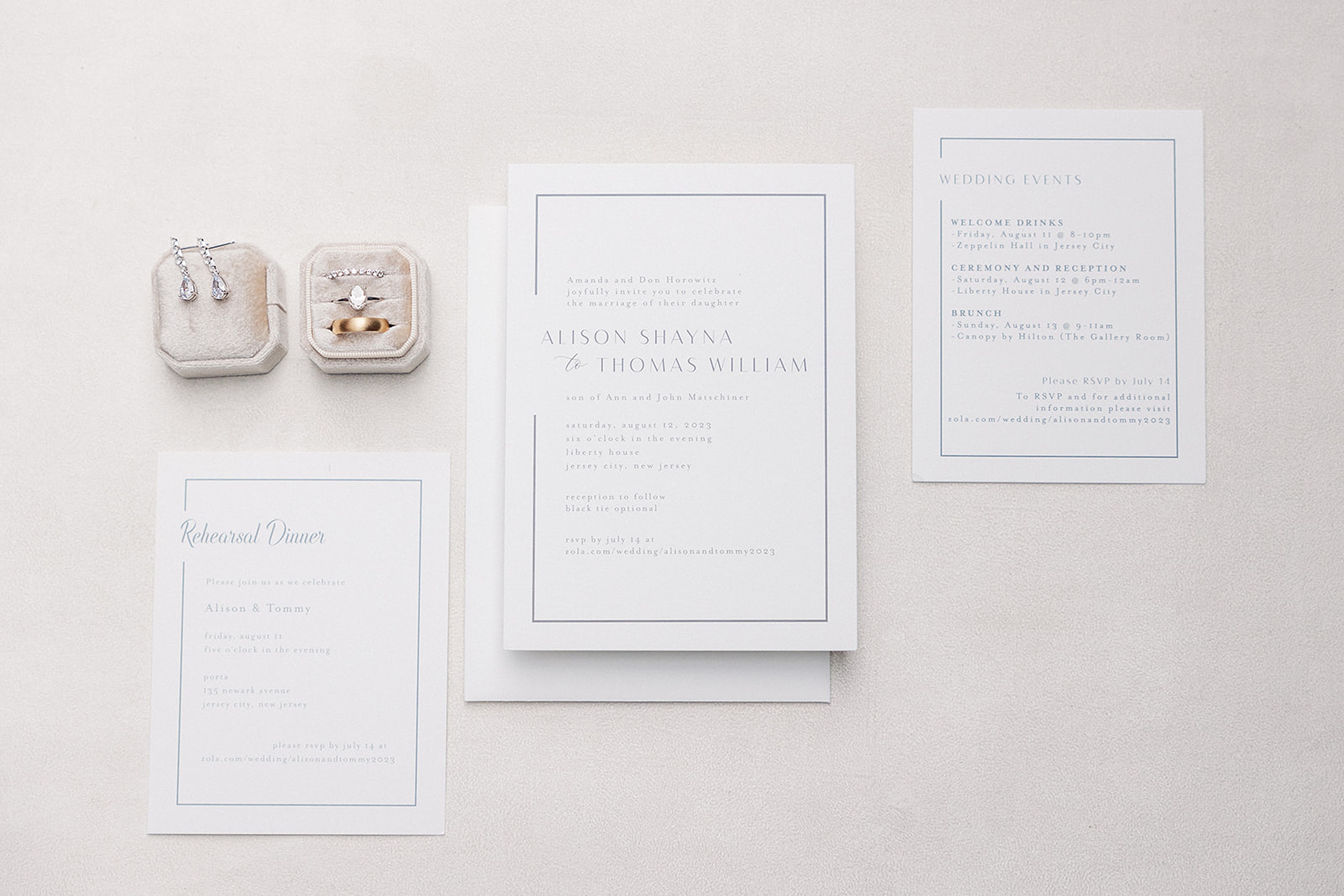 Details of wedding invitations and bridal jewelry