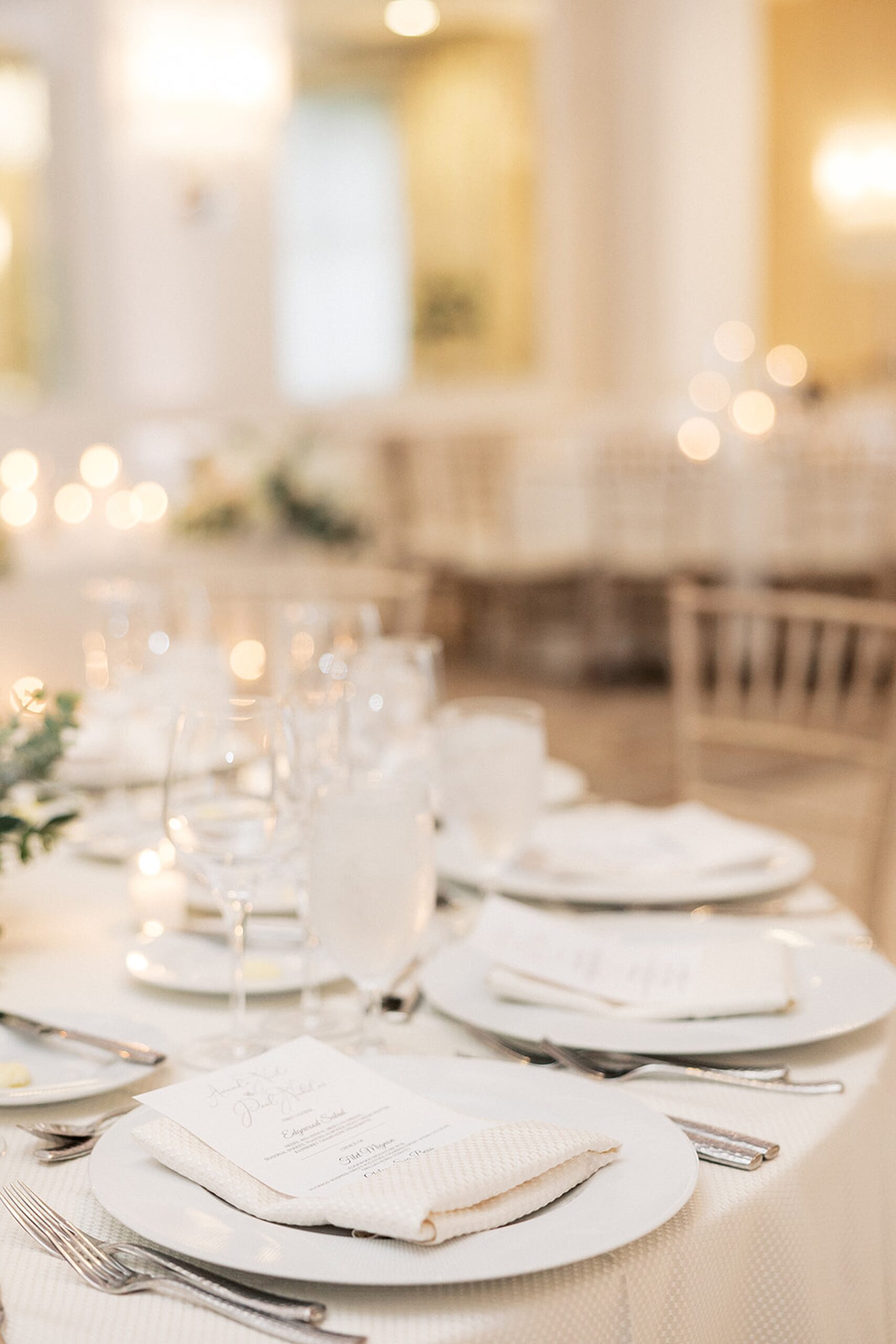 Details of a table setting with white linen at a edgewood country club wedding