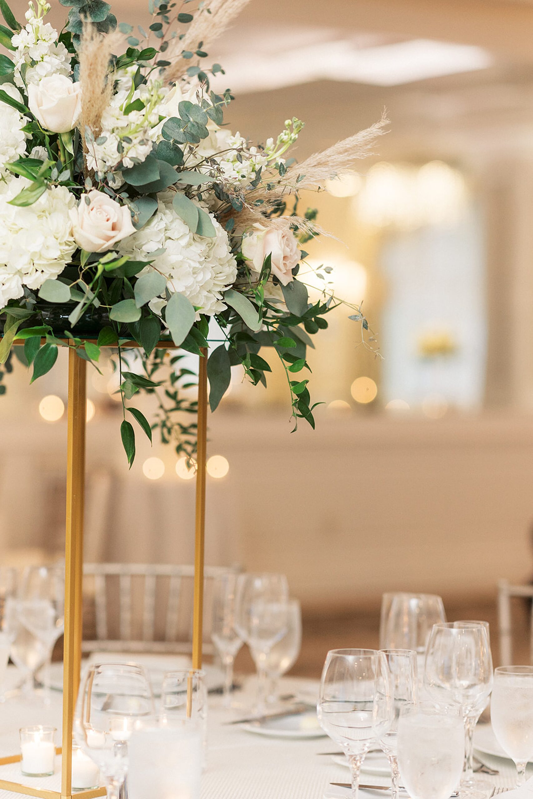 Details of a table setting with white floral center piece