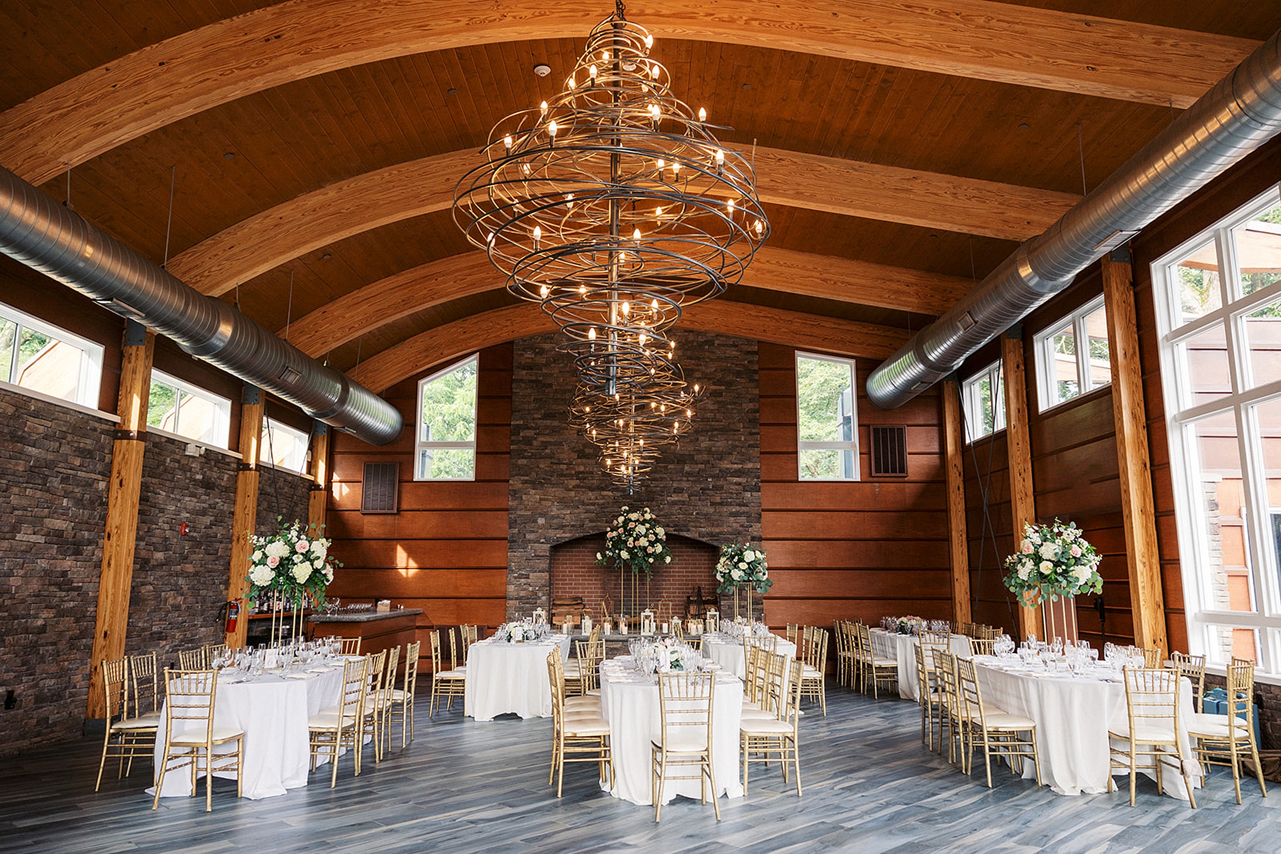 Details of a wedding reception with white linen and golden chairs at the Stonehouse At Stirling Ridge Wedding venue