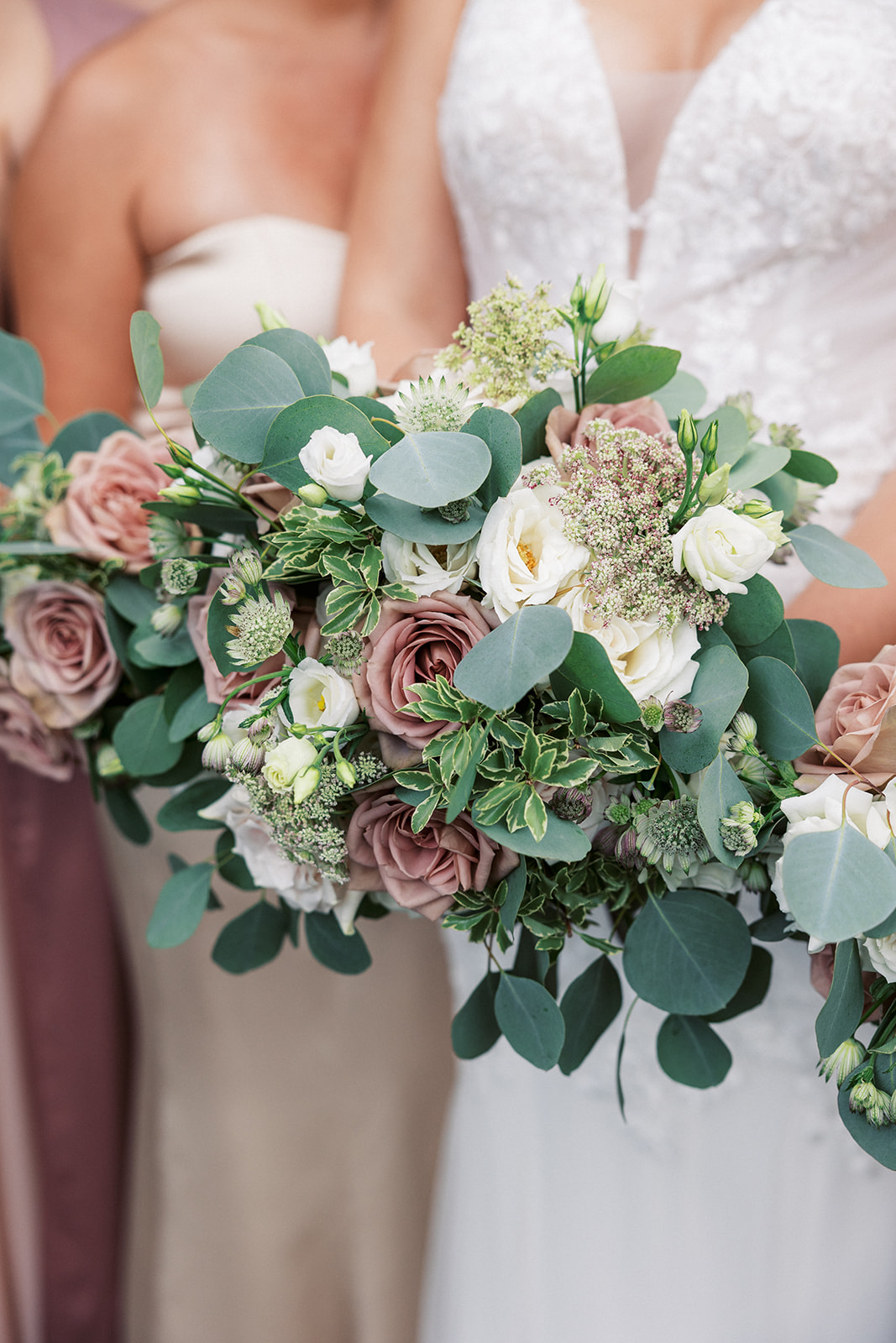 Details of a bride's bouquet with her bridesmaids' at a Bridgewater Mansion Wedding