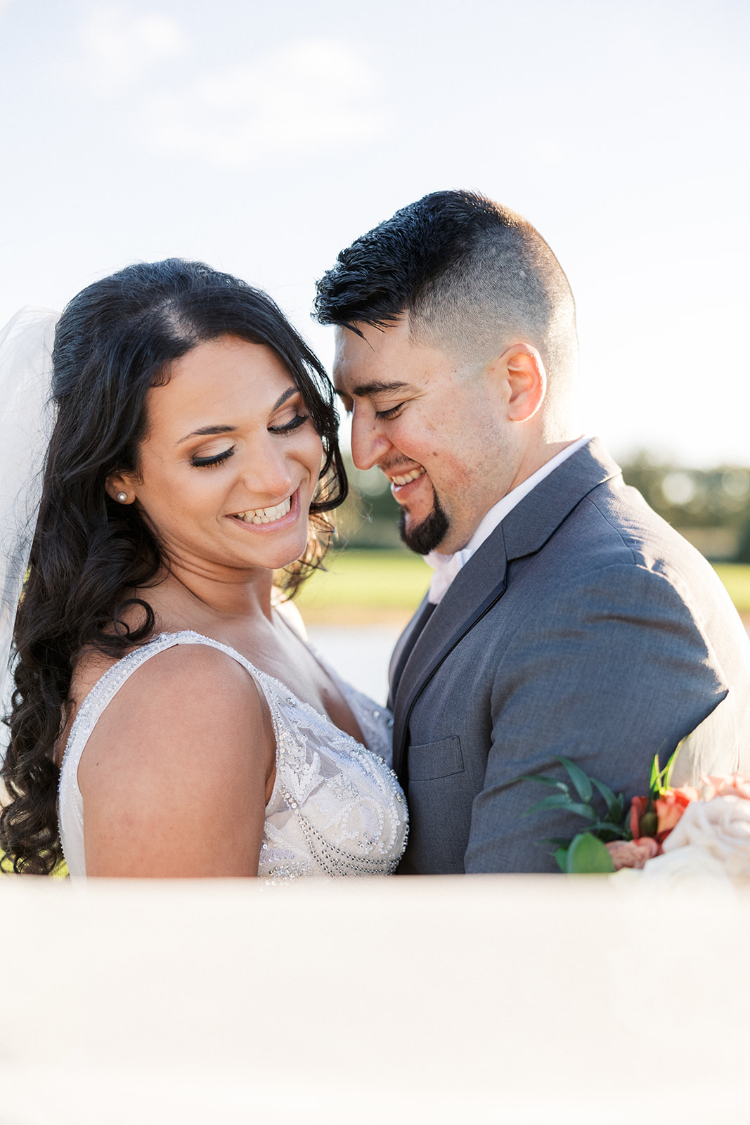 Newlyweds dance together on a green lawn at a Brooklake Country Club Wedding