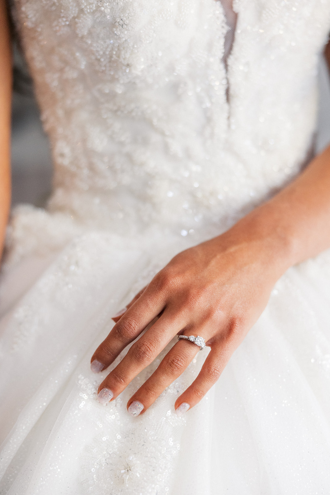 Details of a bride's hand with only her engagement ring on before the ceremony at a Park Avenue Club Wedding