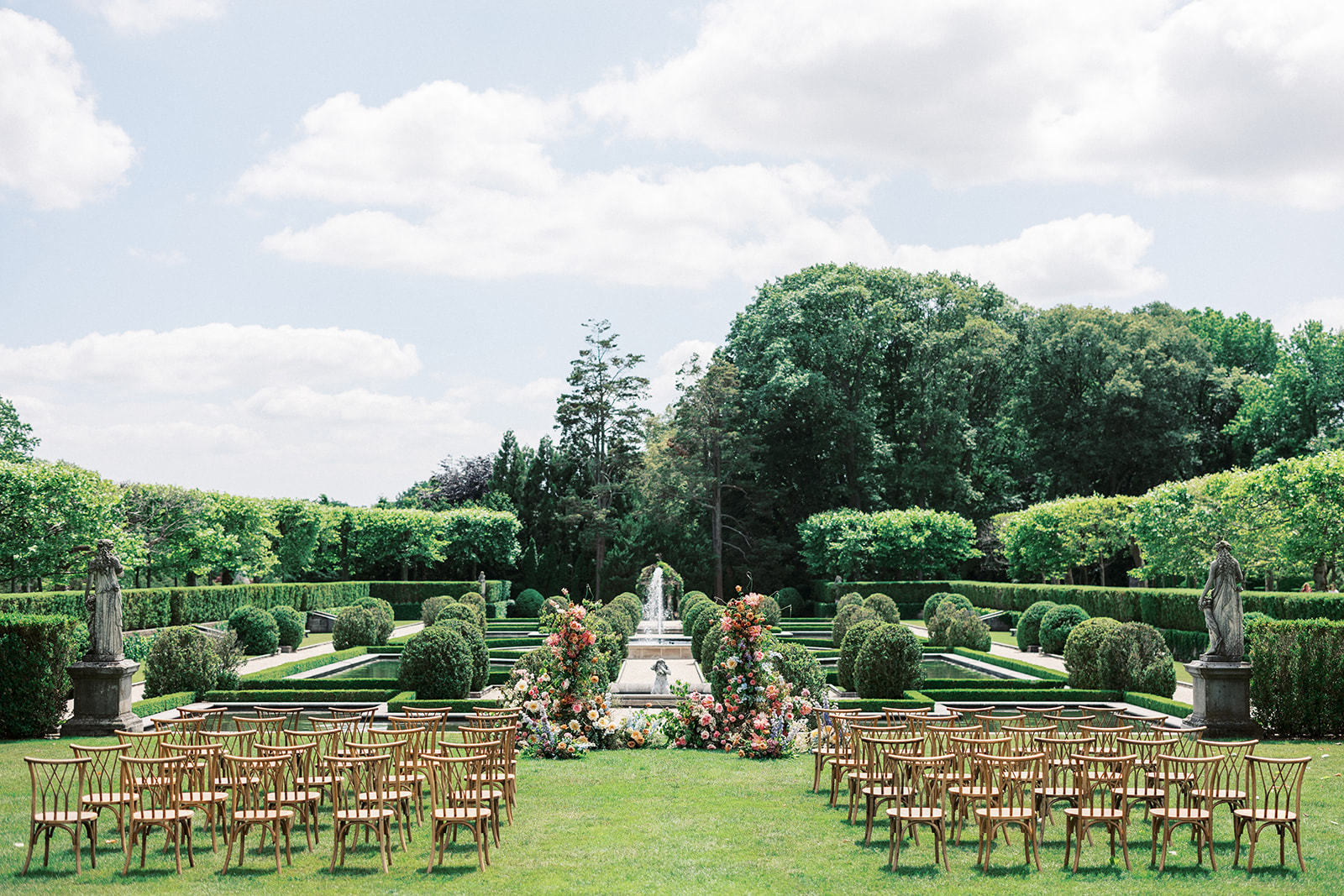 Details of a wedding ceremony set up in the Oheka Castle garden lawn
