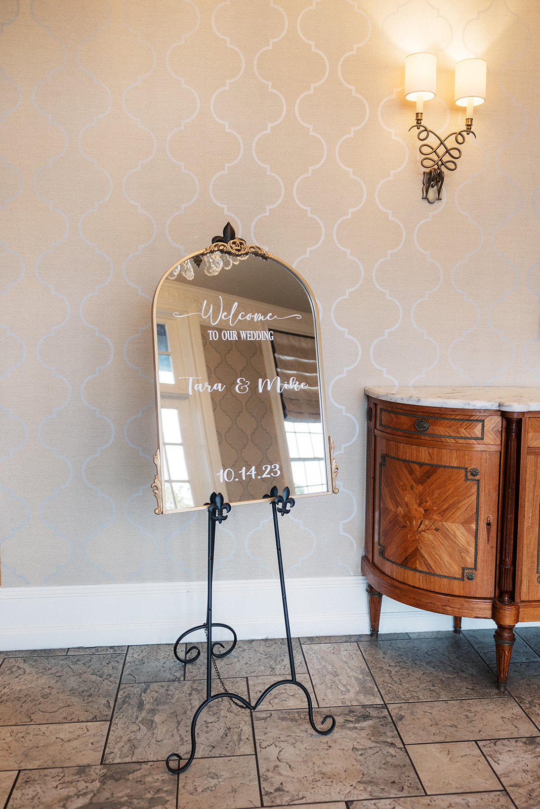 Details of a welcome sign mirror at a The Belle of Blue Bell wedding reception