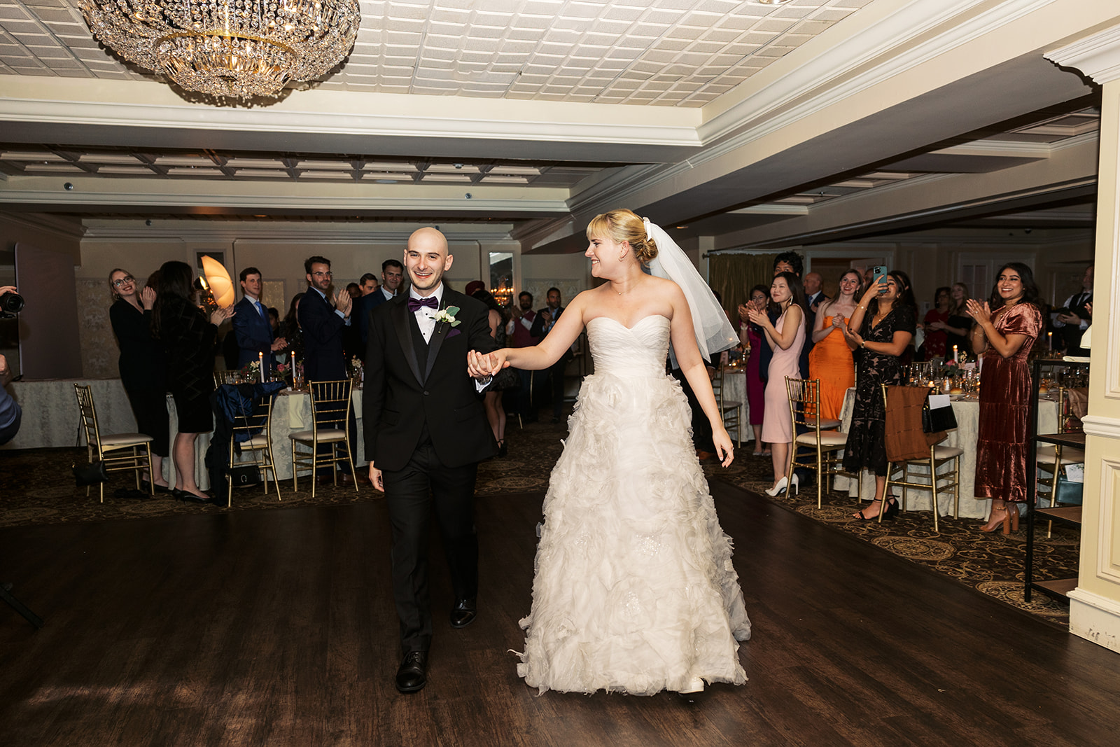 A bride and groom enter the dance floor of their reception at an Olde Mill Inn Wedding
