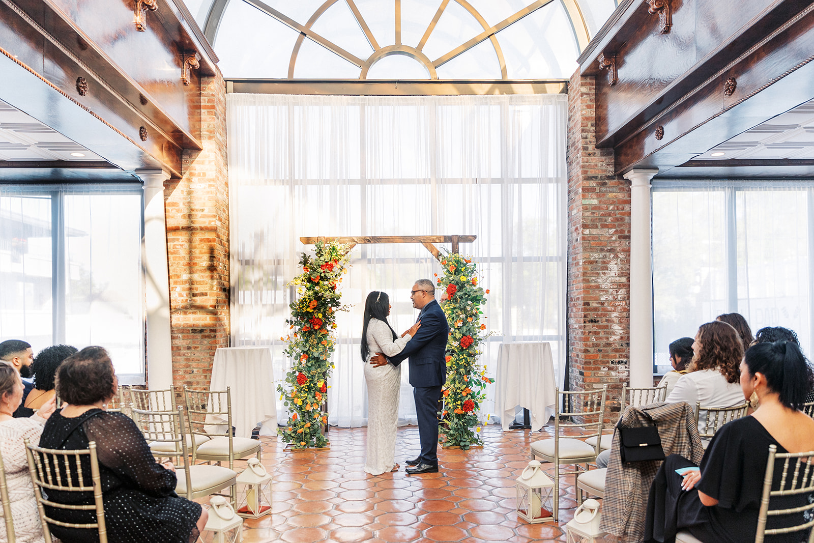 Newlyweds stand together at the altar of their The Shore Club Boutique Hotel wedding ceremony