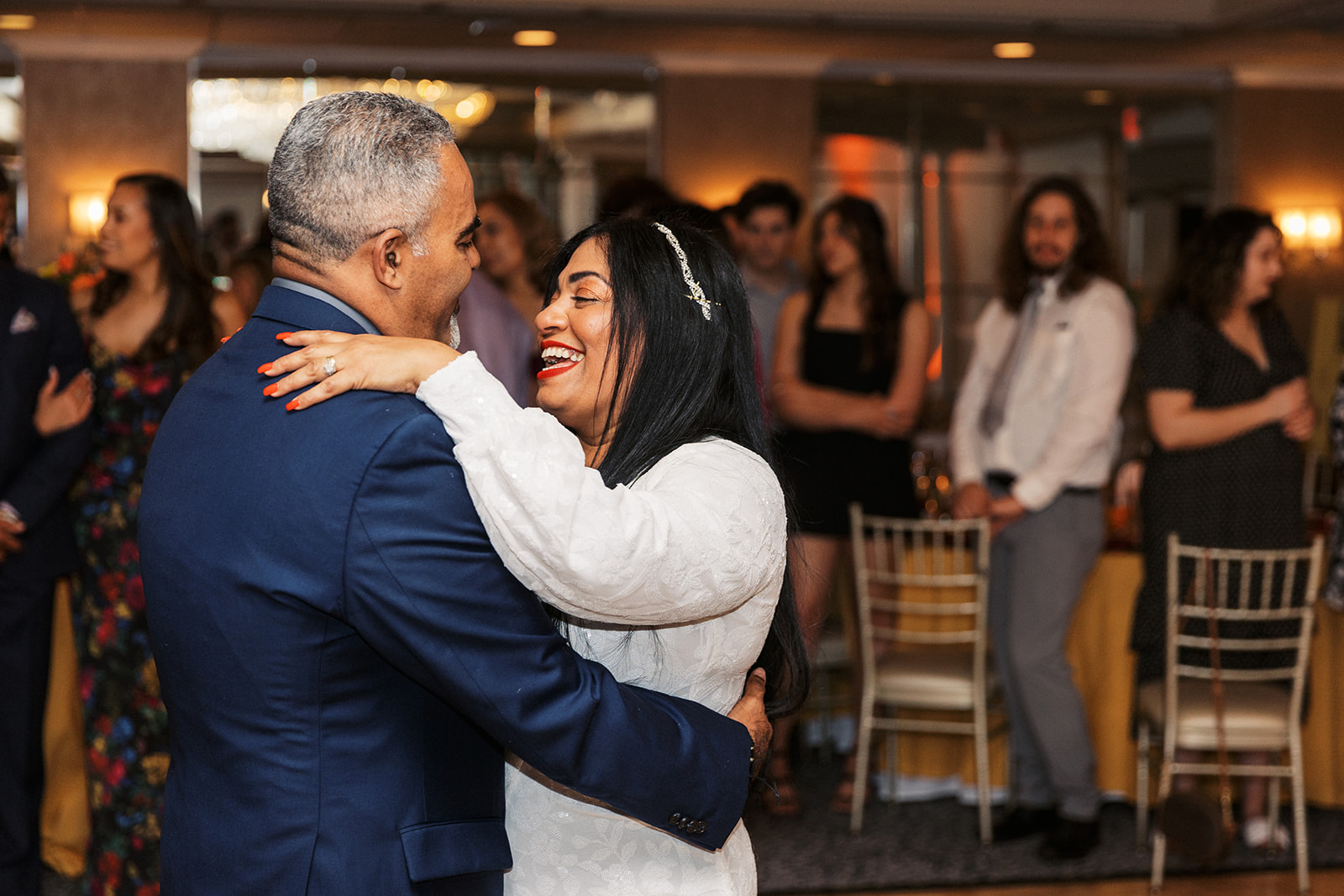 Newlyweds dance for the first time surrounded by guests at The Shore Club Boutique Hotel