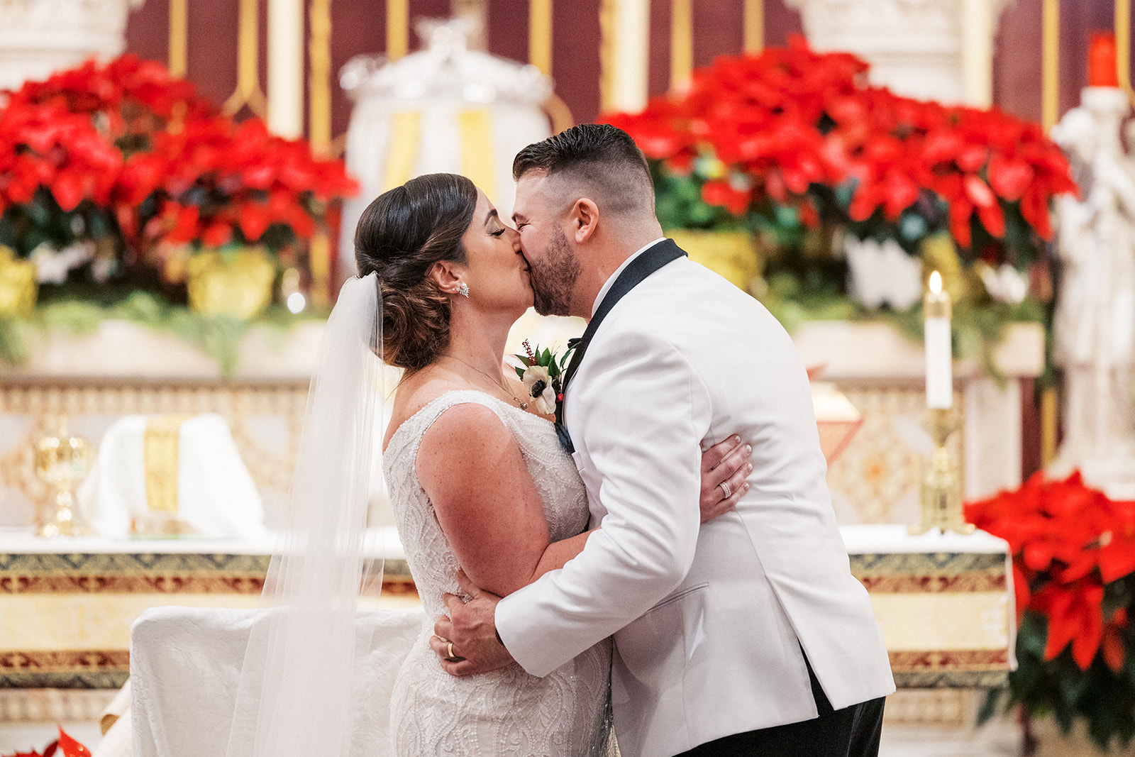 Newlyweds kiss at the altar after their ceremony