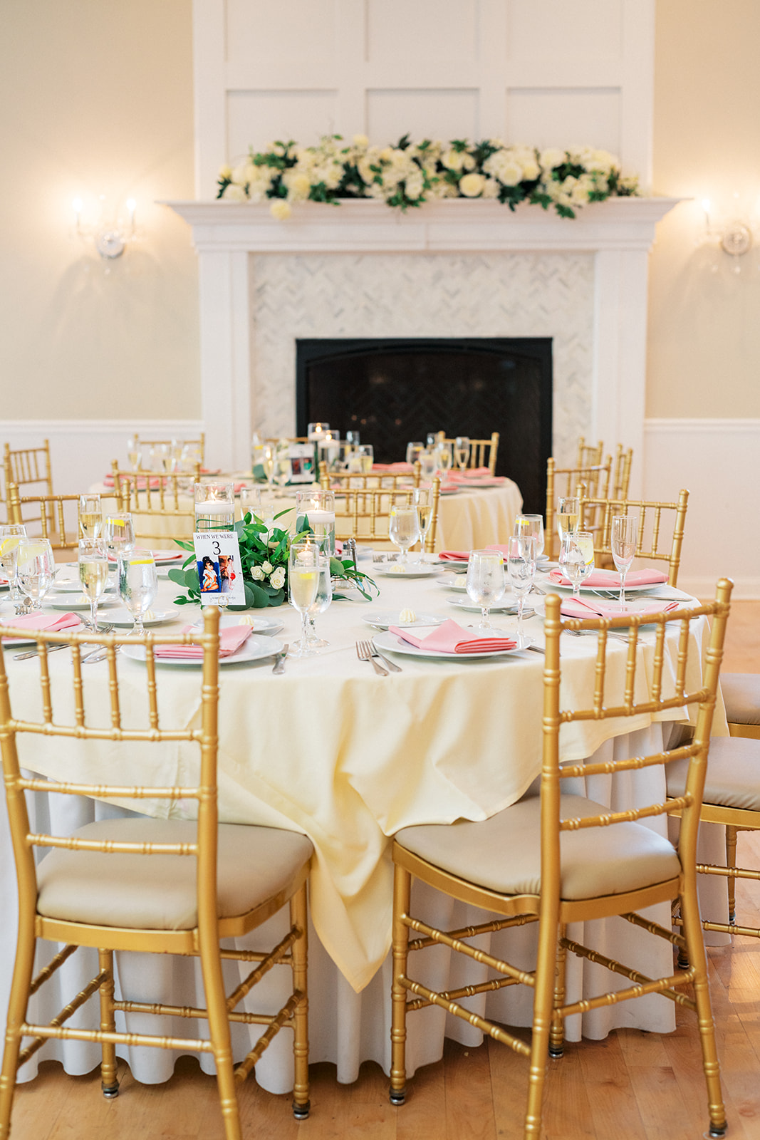 Details of a wedding reception table with gold chairs and pink napkins at the Skyview Golf Club Wedding venue