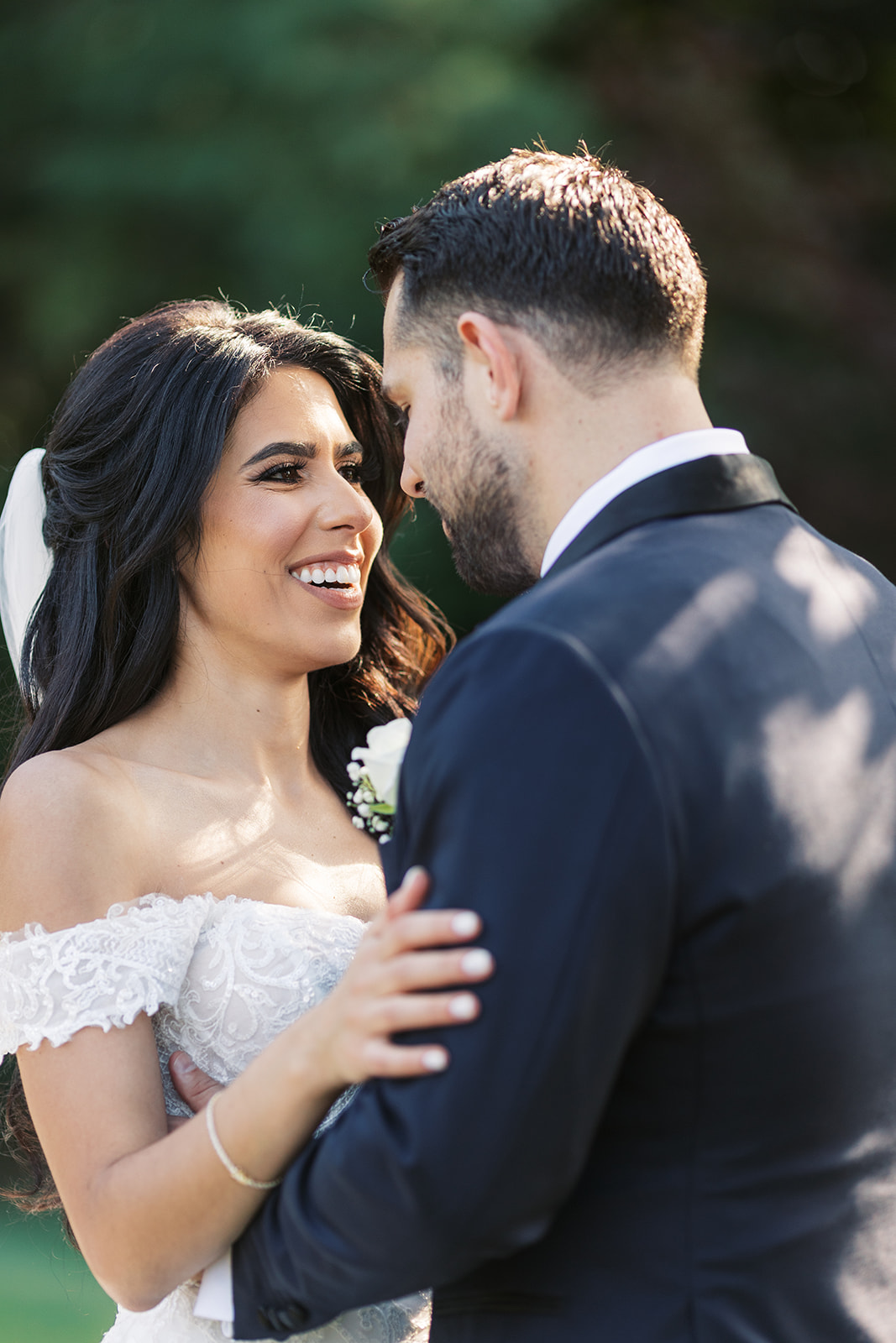 Newlyweds dance and smile while standing in a garden at their The Farmhouse NJ wedding