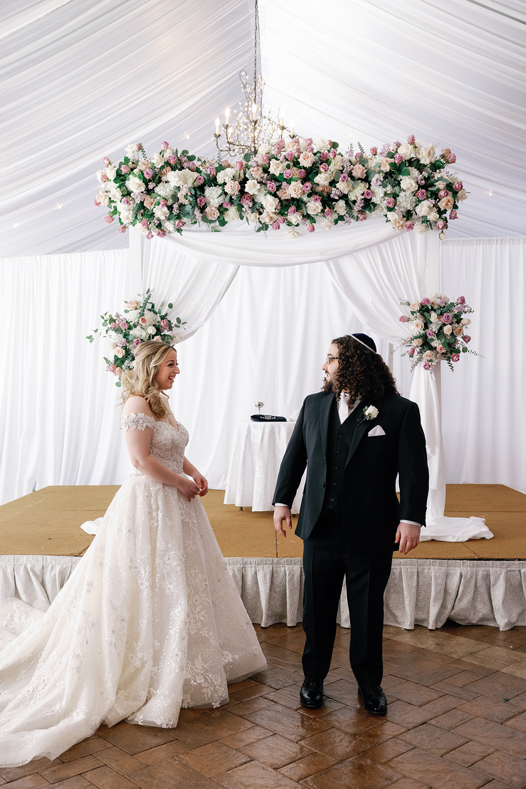 A groom sees his bride for the first time in their ceremony location during a first look
